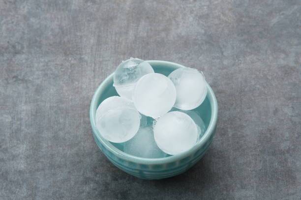 Round ice cubes in small bowl